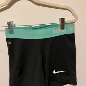 Nike pro spandex, black with turquoise band. Size XS.